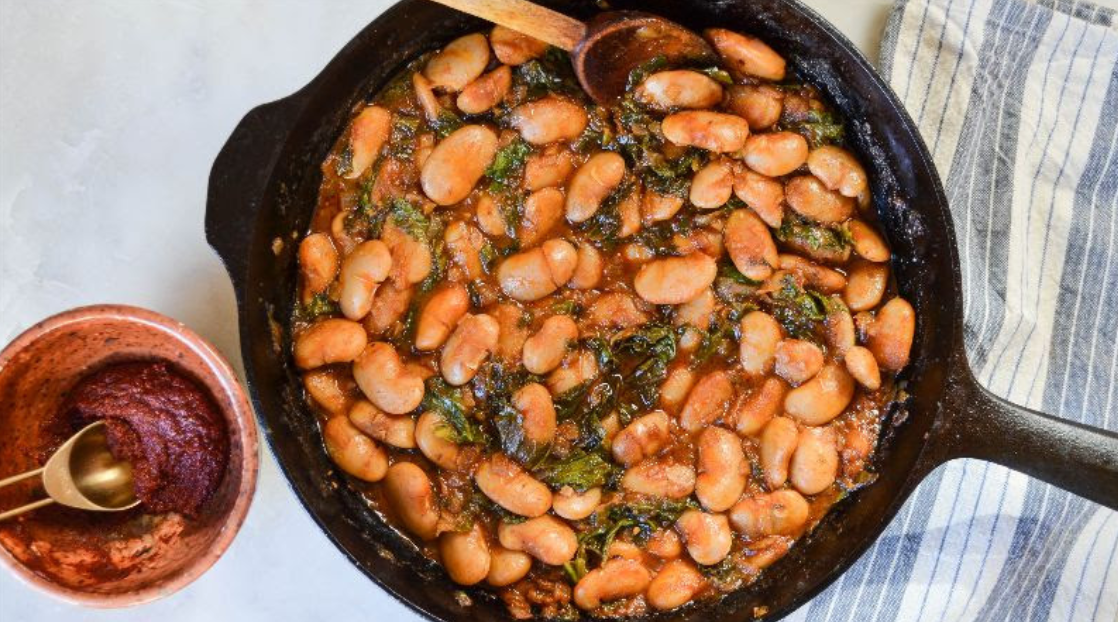 Braised White Beans with Greens and Harissa