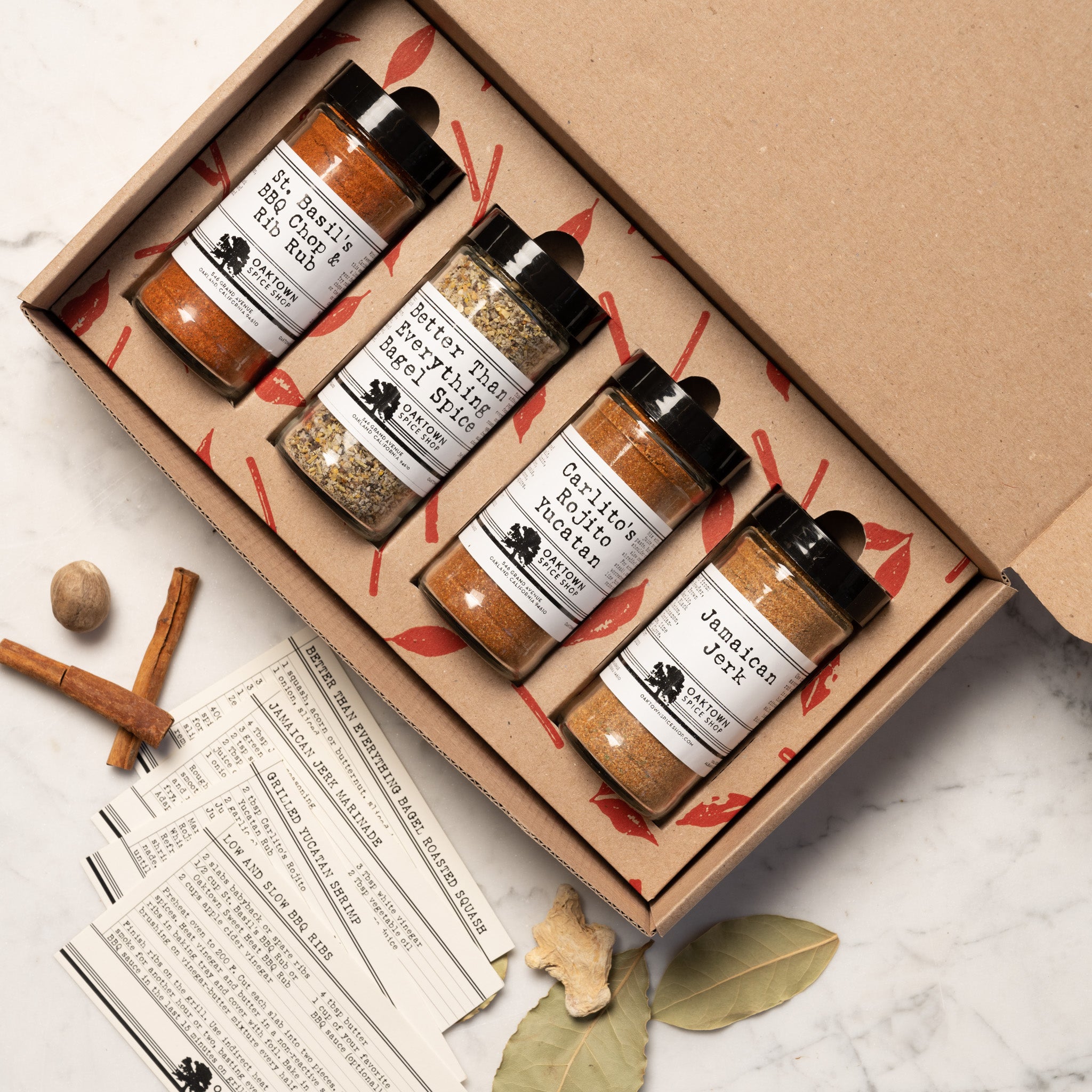 BBQ Master's Gift Box contains Jars of Jamaican Jerk and Carlito’s Rojito Yucatan and Better Than Everything Bagel Spice and St. Basil’s Chop and Rib Rub Every Box is packed with Bay Leaves and Cinnamon Sticks Includes Recipe Cards from Oaktown Spice Shop