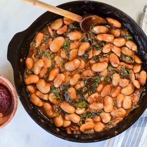 Braised White Beans with Greens and Harissa