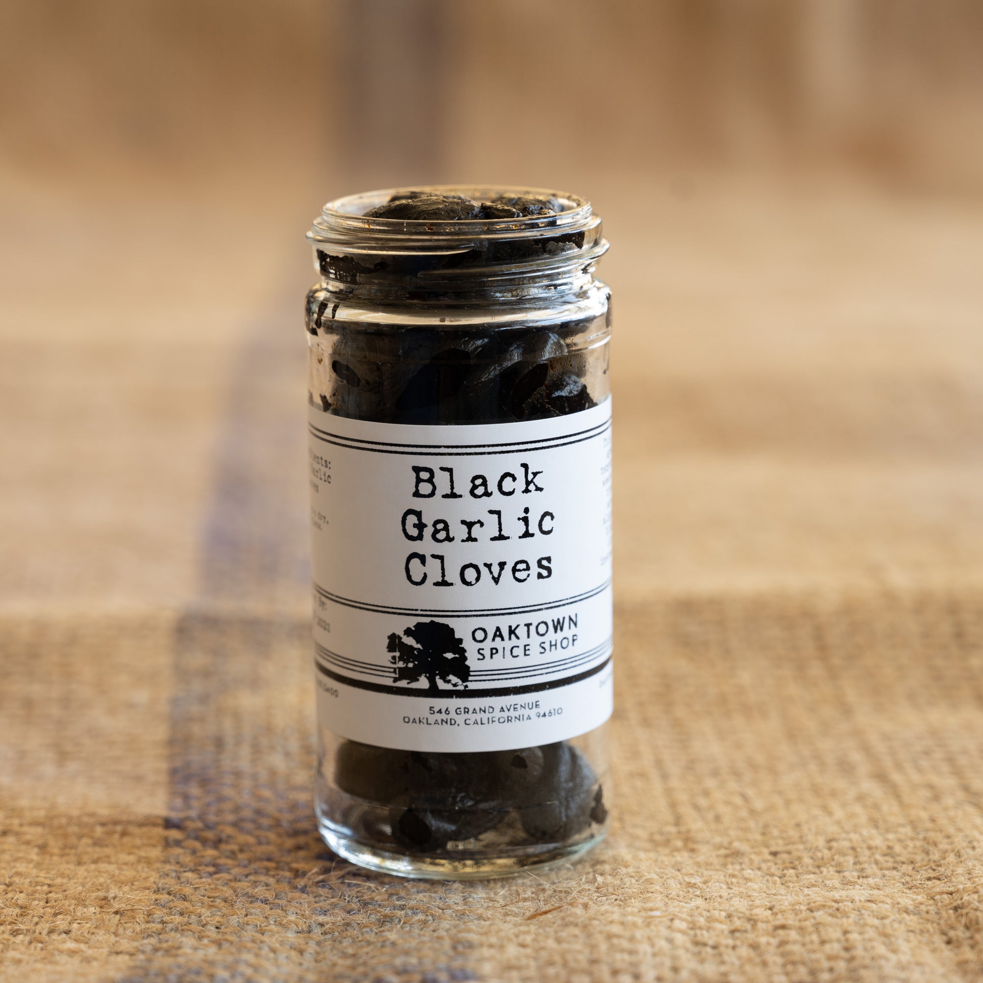 Whole Black Garlic Cloves Aged at low temperatures for weeks to create a sweet and savory and slightly funky flavor from Oaktown Spice Shop